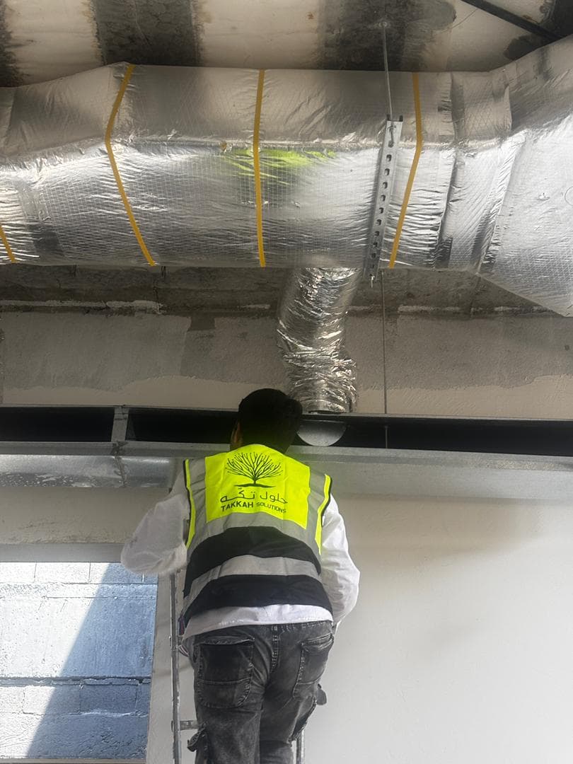 Takkah technician working on a ceiling climate installation